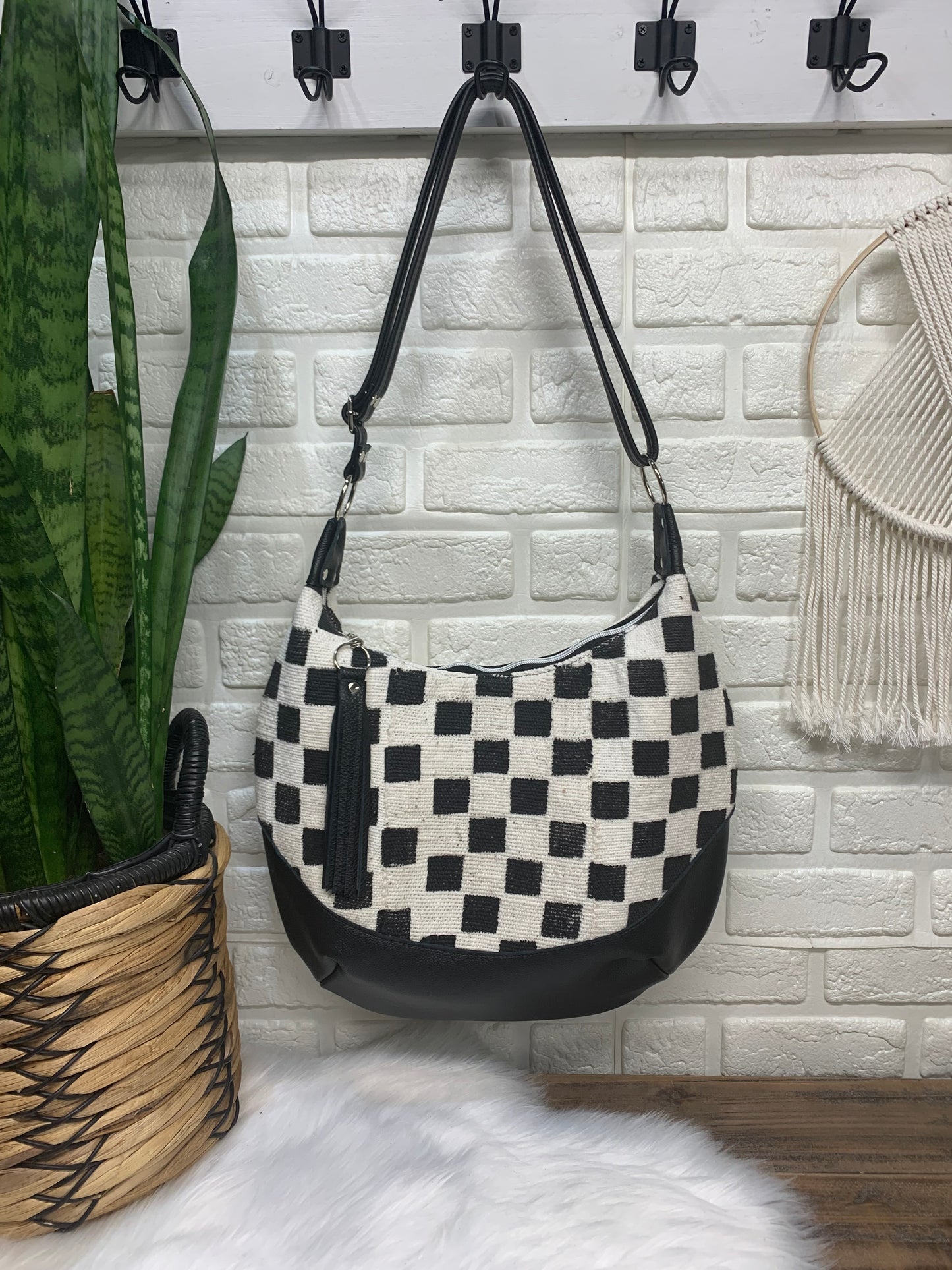 Checkered Mud Cloth and black leather hobo crossbody bag