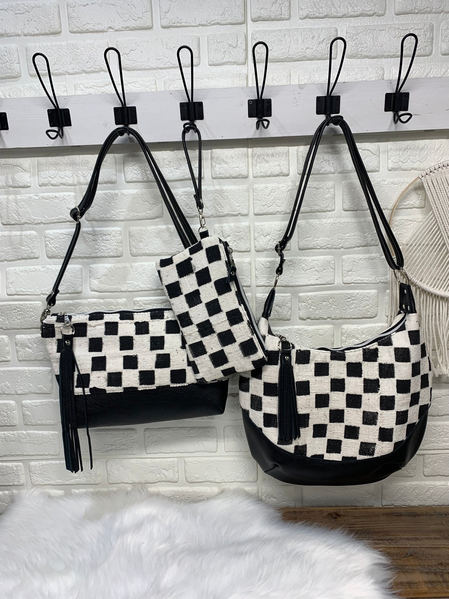 Checkered Mud Cloth and black leather hobo crossbody bag