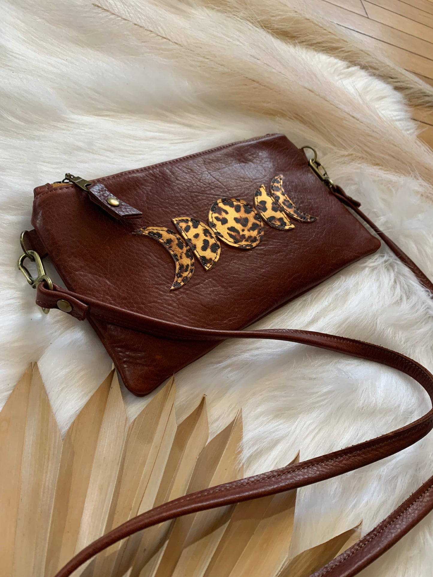 Moon phase brandy leather crossbody clutch, leopard leather