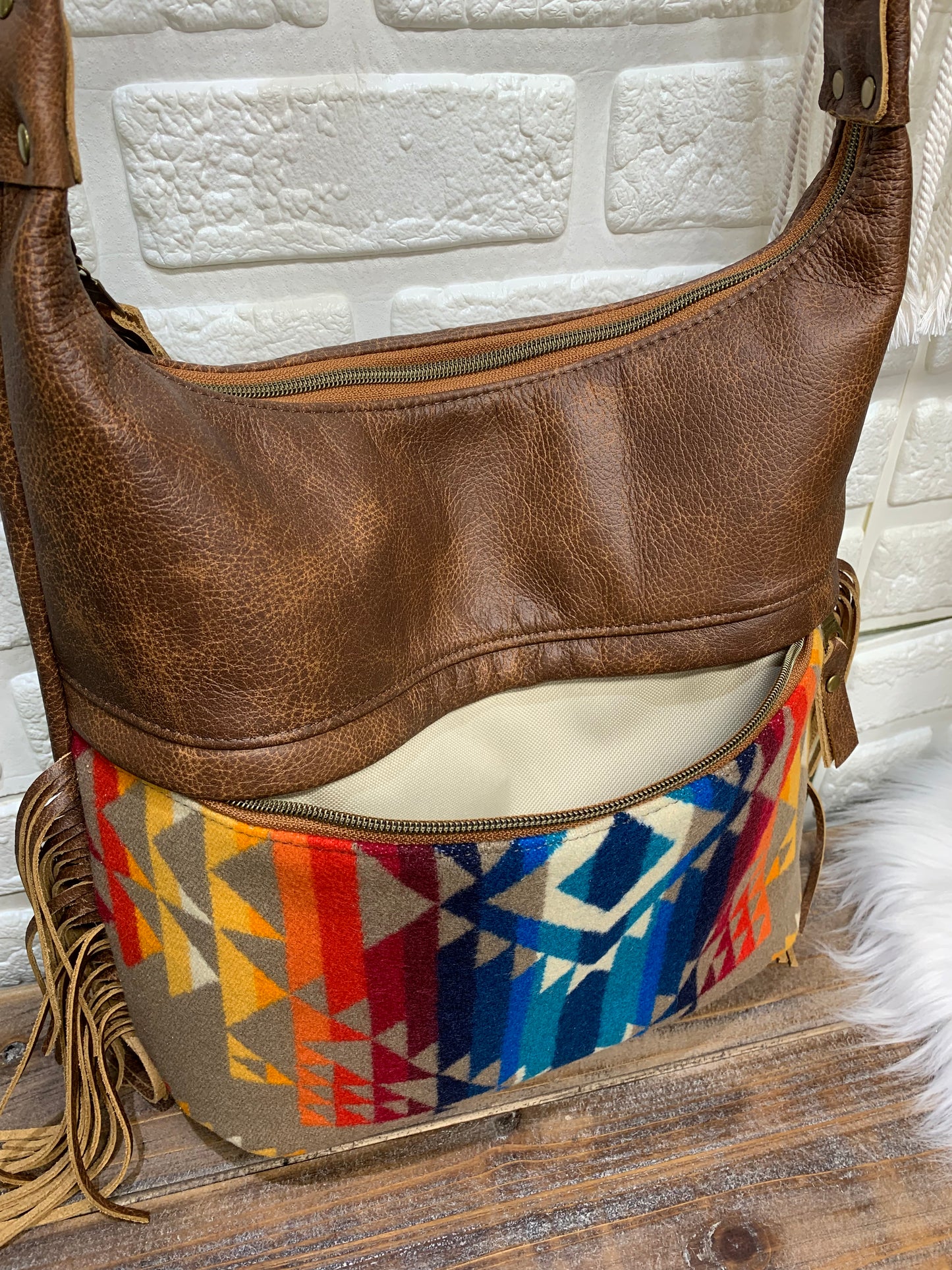 Bucket hobo bag crossbody in Pilot Rock wool and saddle brown leather with Fringe