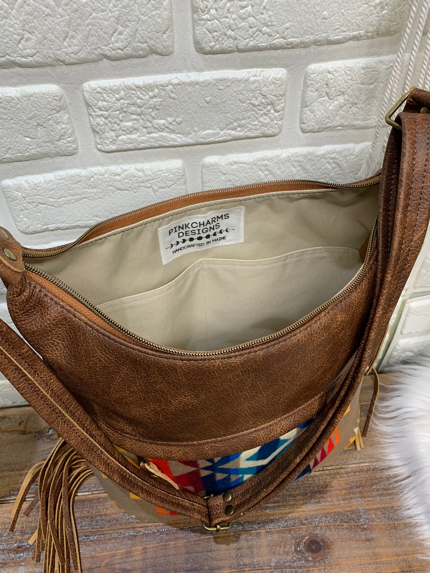 Bucket hobo bag crossbody in Pilot Rock wool and saddle brown leather with Fringe