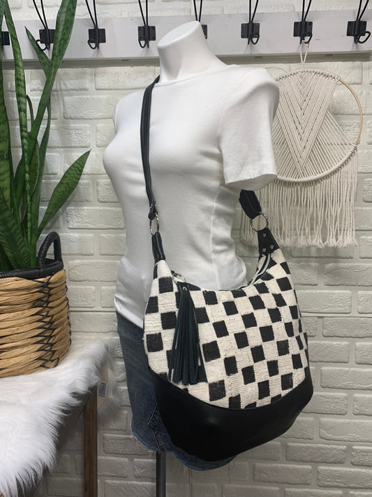 Checkered Mud Cloth and black leather hobo crossbody bag