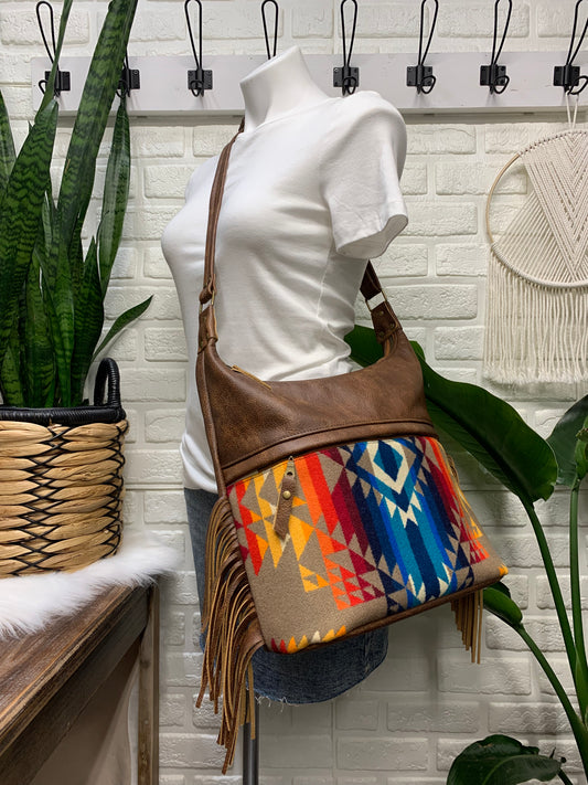 Bucket hobo bag crossbody in Pilot Rock wool and saddle brown leather with Fringe