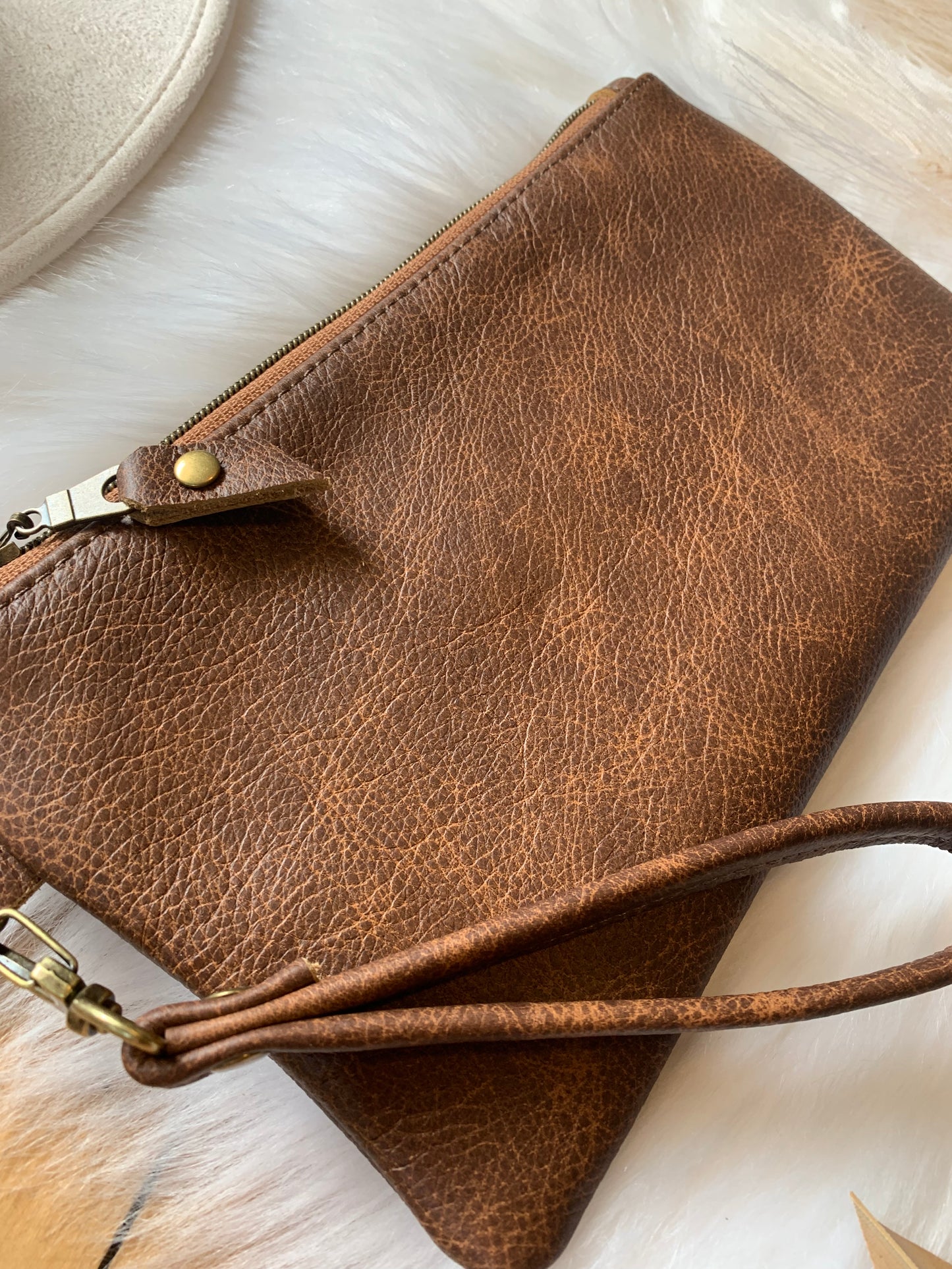Saddle brown two toned leather clutch wristlet