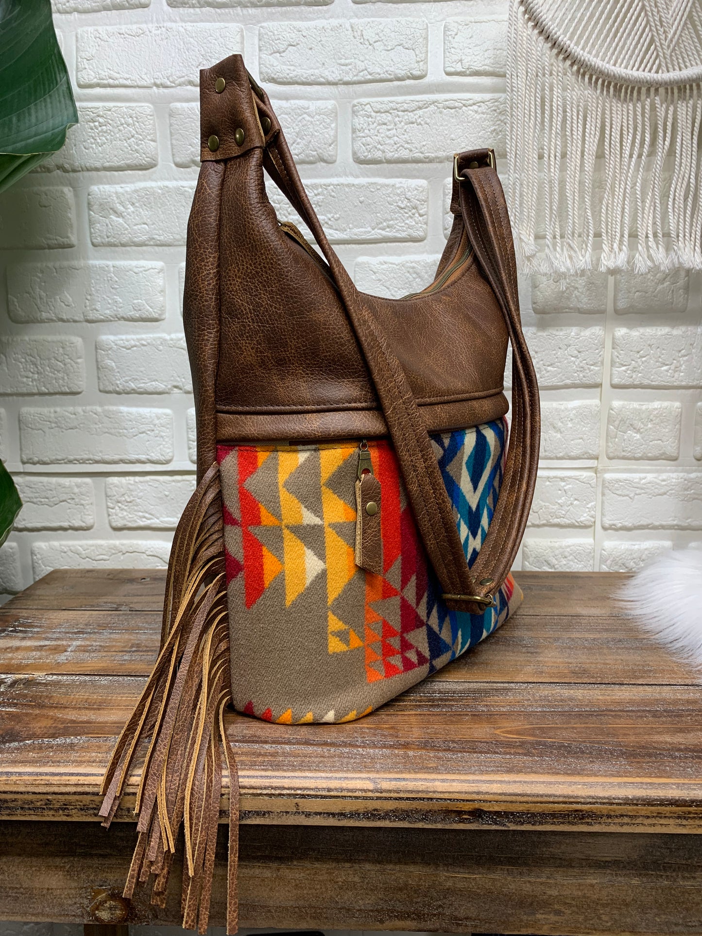 Bucket hobo bag crossbody in Pilot Rock wool and saddle brown leather with Fringe